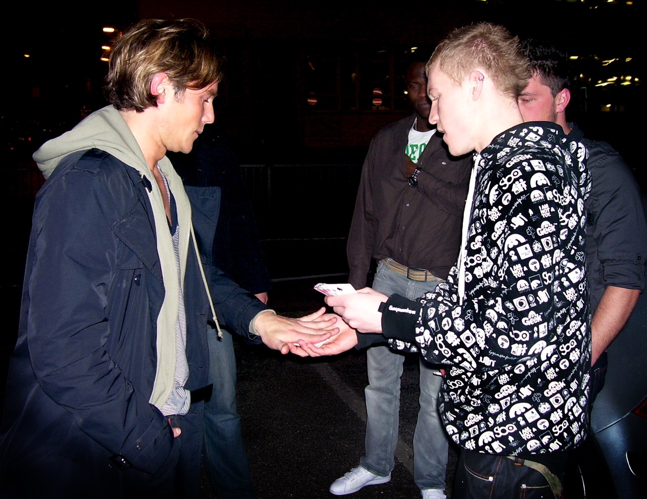 Street Magician Liam Walsh performing close up magic for Big Brother 8 Ziggy, Liam and Brian in Worthing at Liquid Lounge